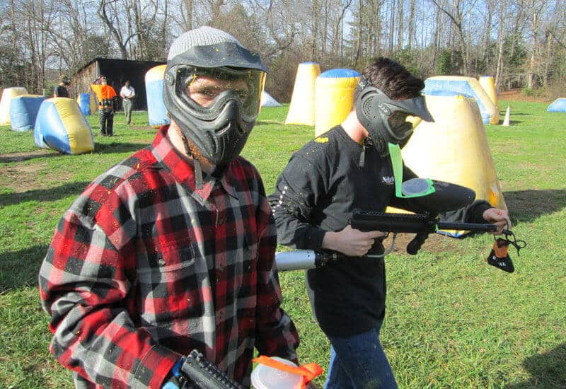 Men in recovery playing paintball