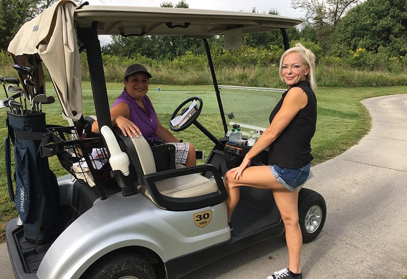 Women golfing